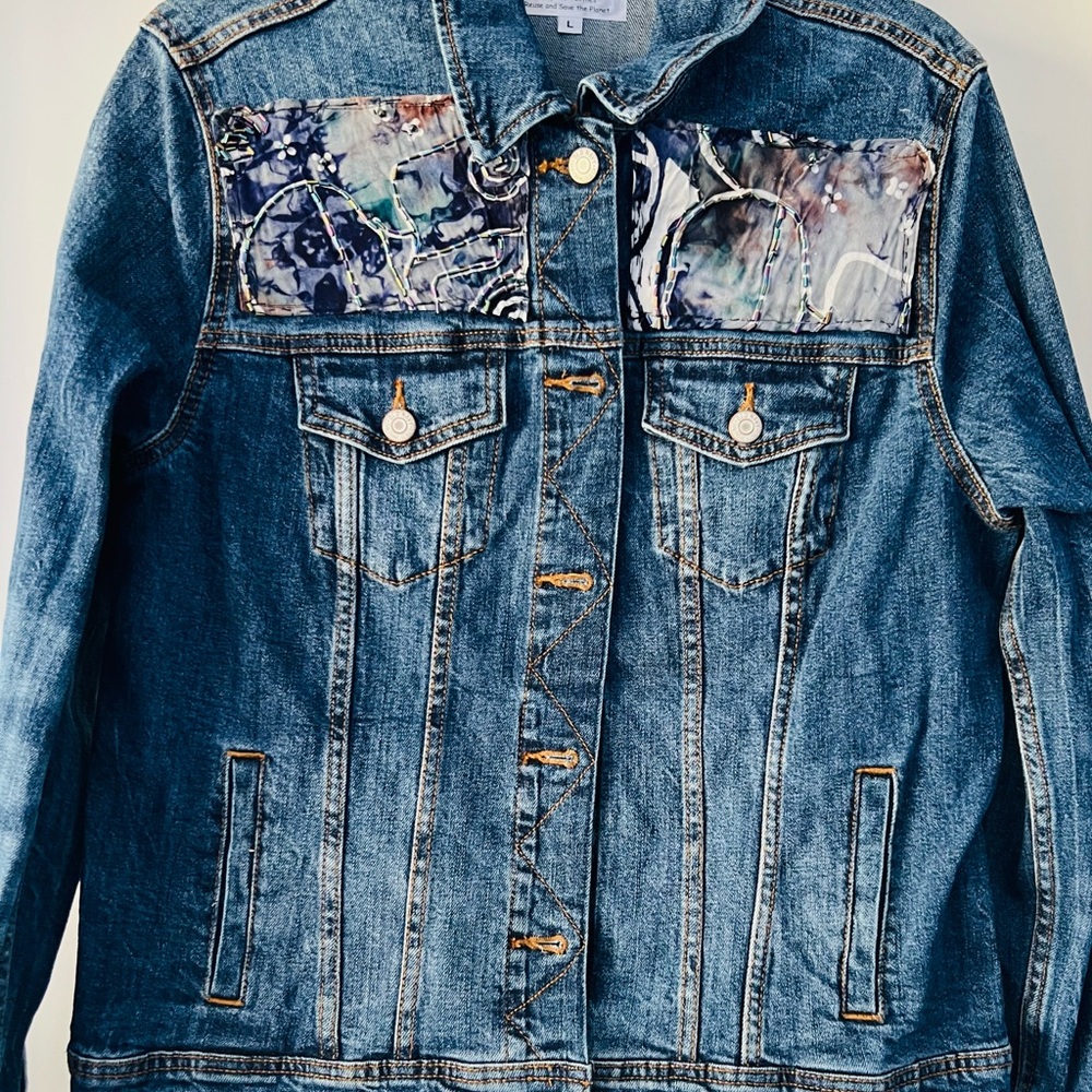 Repurposed Denim Jacket with Artistic Patches of Batik fabric and beads/sequins.